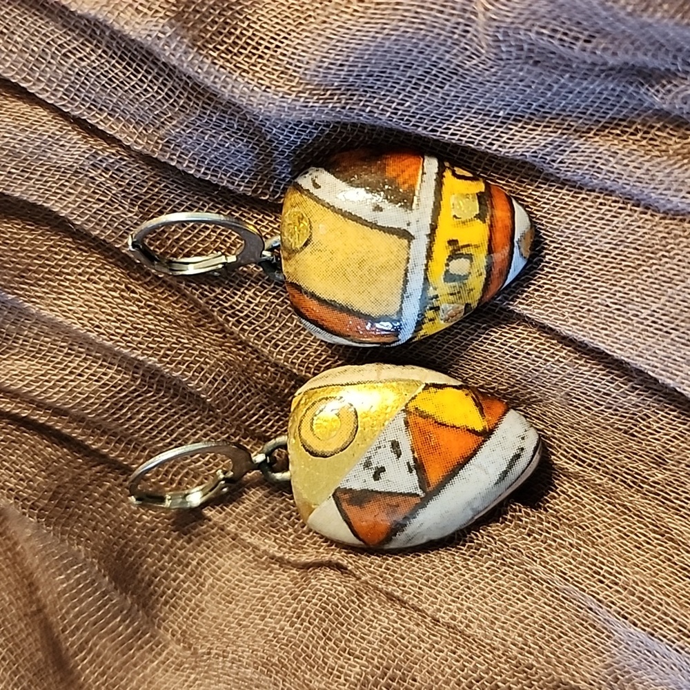 Artisan created ceramic earrings on stainless steel leverbacks.